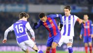 Barcelona's Brazilian forward Neymar da Silva Santos Junior (centre) vies with Real Sociedad's defender Aritz Elustondo (left) and midfielder Xabier Prieto during the Spanish Copa del Rey quarter final first leg match at the Anoeta Stadium in San Sebastia
