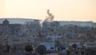 Smoke billows from reported shelling by Syrian government forces on the rebel-held area of Daraa, in southern Syria on Janauary 22, 2017 (AFP Photo/MOHAMAD ABAZEED).