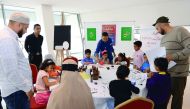 Children participate in an Arabic calligraphy workshop held as part of the ‘The Beacon of Knowledge and Light’ festival.