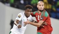 Morocco's midfielder Karim El Ahmadi (right) challenges Ivory Coast's forward Wilfred Zaha during the 2017 Africa Cup of Nations group C match b in Oyem on Tuesday. Morocco won 1-0 to advance to the next stage.
