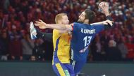 Sweden's Jim Gottfridsson (right) defends against France's Nikola Karabatic during their 25th IHF Men's World Championship 2017 quarter final   on Tuesday.