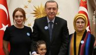 This handout photo taken and released by Turkey's Presidential Press Office on January 27, 2017 shows (from L) American actress Lindsay Lohan, Turkish President Recep Tayyip Erdogan, 7 years old Bana el-Abed, who sended messages through Twitter documentin