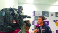 Nasser Saleh Al Attiyah, Qatar's premier rally driver, talks to a TV crew during an interview at Losail International Circuit yesterday. 