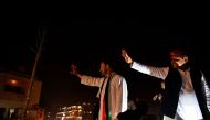 Congress party Vice President Rahul Gandhi (L) and Uttar Pradesh state Chief Minister Akhilesh Yadav (R) wave to the crowd during a joint election rally with in Agra on February 3, 2017. AFP / CHANDAN KHANNA
