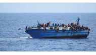Migrants are seen on a capsizing boat before a rescue operation off the coast of Libya in this photo released by the Italian Marina Militare. (File photo: Reuters).