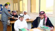A teacher and students at Hassan bin Thabit Independent Secondary School for Boys yesterday.