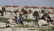 Palestinian students return from school to their homes near the Jewish settlement of Maale Adumim in the West Bank village of Al-Eizariya, east of Jerusalem March 1, 2016 (REUTERS / Ammar Awad) 