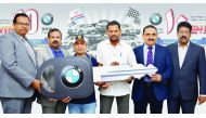Winners of Safari Win 10 BMW 5 series car promotion third lucky draw, Romeo Jr Laloma Marcado and Musthafa CK receiving the key from Zainul Abideen, Director and General Manager, Safari Group, along  with other Safari officials at a ceremony held at Safar