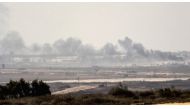 A picture taken from the Israel-Gaza border shows smoke rising from the Hamas-ruled Gaza Strip following an Israeli military strike on October 5, 2016. (Jack Guez/AFP).