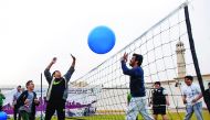 President of the Qatar Olympic Committee, H E Sheikh Joaan bin Hamad Al Thani plays with kids during the National Sport Day celebrations in Doha yesterday.