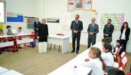 Deputy Secretary-General of the Turkish Presidency Prof Ibrahim Kalin and Principal of the Turkish School Mehmet Ali talking to students during a visit after the opening of the Turkish School in Doha yesterday. Pic: Abdul Basit / The Peninsula
