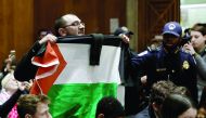A supporter of Palestinian rights disrupts the confirmation hearing of David Friedman, US President Donald Trump's nominee to be the next US ambassador to Israel, as Friedman testifies before the Senate Foreign Relations Committee in Washington, yesterday