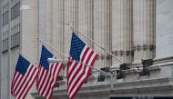 A street sign is seen near the New York Stock Exchange in New York on February 16, 2017. Wall Street stocks finished mixed Thursday as a five-day streak of record highs finally began to show signs of fatigue. / AFP / Bryan R. Smith
