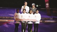 Young supporters of Educate A Child programme with Qatar Total winner Karolina Pliskova and runner-up Caroline Wozniacki.