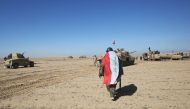 Iraqi forces, supported by the Hashed al-Shaabi (Popular Mobilisation) paramilitaries, prepare to advance advance towards the village of Sheikh Younis, south of Mosul, after the offensive to retake the western side of the city from Islamic State (IS) grou