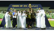 Players of Taleb Group celebrate with the champions trophy after winning the 2016 Workers Cup with team and tournament officials during the presentation ceremony in this file photo. Taleb Group will be looking to defend their title when the 2017 edition o