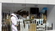A visitor looks at munitions on display during the International Defence Exhibition and Conference (IDEX) in Abu Dhabi, United Arab Emirates February 19, 2017. REUTERS/Stringer
