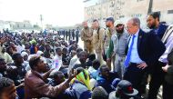 UN envoy to Libya, Martin Kobler, talks to illegal migrants during a visit at a detention centre in the Libyan capital Tripoli, yesterday.