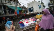 The four richest Indonesians are wealthier than the poorest 100 million people in the country, a study has found, highlighting how huge numbers have been left behind as the economy booms. PHOTO: AFP.