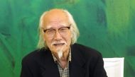 This picture taken on September 2, 2001, shows Japanese director Seijun Suzuki posing during a photo call for the presentation of 