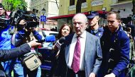 Rodrigo Rato (centre), Bankia’s former chairman, being questioned by media persons outside the court.