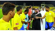 Qatar Stars League (QSL) CEO Hani Ballan and Nasser AlKhater, Executive Director of Communications and Marketing at Supreme Committee for Delivery & Legacy (SC), are introduced to the players during the inauguration of the Workers Cup at Qatar SC Stadium 