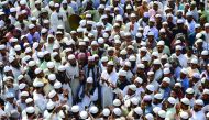 Activists from the Bangladesh Islamist group offer prayers as they take part in a protest in Dhaka yesterday calling for statue of a Greek goddess installed at the Supreme Court to be removed.