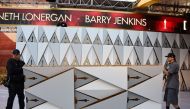 Workers build the red carpet arrivals area ahead of the 89th annual Oscars outside the Dolby Theater in Hollywood, California on February 23, 2017.  AFP / Robyn BECK
