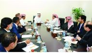 Adil Abdurrahman Al Mannai (centre), Head of the Trade and Research Committee at Qatar Chamber, with owners and representatives of major shopping malls in a meeting at the headquarters of Qatar Chamber.