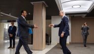 UN Special Envoy for Syria Staffan de Mistura (R) shakes hands to Syria's main opposition High Negotiations Committee (HNC) leader Nasr al-Hariri upon his arrival for a meeting on February 27, 2017 in Geneva. A ban on mobile phones, recording devices and 