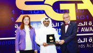 Abdullah Ahmed Al Ali, IT Director at the Ministry of Economy and Commerce, receiving the award.