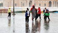 File picture of children enjoying rains at Katara. 