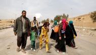 Displaced Iraqis flee their homes in Mamoun district as Iraqi forces battle with Islamic State militants, in western Mosul, Iraq March 1, 2017. REUTERS/Zohra Bensemra
