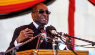 Zimbabwe President Robert Mugabe speaks during the burial of two national heroines Victoria Chitepo and Vivian Mwashita at the National Heroes Acre on April 13, 2016 in Harare (AFP / Jekesai Njikizana) 