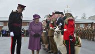 Britain's Queen Elizabeth reviews members of The Royal Welsh Regimental Family and one of two regimental goats at Lucknow Barracks during a visit to mark St David's Day, in Tidworth, Britain March 3, 2017. REUTERS/Ben Birchall