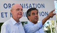 (FILES) This file photo taken on August 28, 2016 shows former French Prime Minister and then candidate for the right-wing Les Republicains (LR) party primary ahead of the 2017 presidential election Francois Fillon (R) pointing a finger next to his campaig