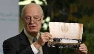 UN Special Envoy of the Secretary-General for Syria Staffan de Mistura shows a picture during a press conference as part of the Intra-Syrian peace talks at the European headquarters of the United Nations in Geneva, on March 3, 2017.  AFP / PHILIPPE DESMAZ
