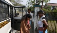 Indian Crime Investigation Department (CID) officials escort Sonali Mandal (C) from CID office in Siliguri on March 4, 2017, towards an appearance at a court in Jalpaiguri in the eastern Indian state of West Bengal, after her arrest as part of an alleged 