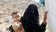  A woman holds a child near the Mocha port on the Red Sea in Taiz, Yemen on March 1, 2017. Escalating clashes cause internal migration of thousands of Yemeni civilians. Due to clashes taking place in Mocha, Dhubab and Al Wazi'iyah districts of Taiz many Y