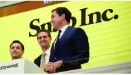 Snap Inc. co-founder Bobby Murphy(L) with CEO Evan Spiegel(C) and NYSE President Thomas Farley, ring the opening bell at the New York Stock Exchange on March 2, 2017 in New York. / AFP / Bryan R. Smith
