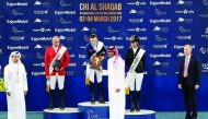H E Sheikh Joaan bin Hamad bin Khalifa Al Thani, President of Qatar Olympic Committee, presenting the trophy to Scott Brash of Great Britain, winner of the CSI5* event at the CHI Al Shaqab, at Al Shaqab Arena yesterday. Omar Karaevli of Turkey finished se