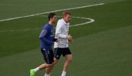 Real Madrid's Portuguese forward Cristiano Ronaldo (L) jogs with a teammate during a training session at Valdebebas Sport City in Madrid on March 3, 2017 on the eve of their Liga football match against Eibar. / AFP / PIERRE-PHILIPPE MARCOU
