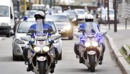 A police convoy of cars transporting two suspects in the murder of the French Troadec family, arrives at the Nantes courthouse on March 6, 2017, for the suspects to be presented before an investigating judge. The brother-in-law of a Frenchman who went mis