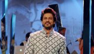 Indian Bollywood actor Shah Rukh Khan showcases a creation by designer Manish Malhotra at the fundraiser Mijwan 2017 fashion show in Mumbai on March 5, 2017. / AFP / STRINGER
