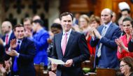 Canada's Finance Minister Bill Morneau receives a standing ovation while announcing the date of the federal budget during Question Period in the House of Commons on Parliament Hill in Ottawa, Ontario, Canada.