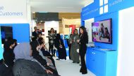Visitors at the Microsoft booth at QITCOM.