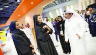 H H Sheikha Moza bint Nasser and H E Sheikha Hind bint Hamad Al Thani at the QITCOM exhibition, yesterday.
