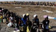 Women and children wait to be registered prior to a food distribution carried out by the United Nations World Food Programme (WFP) in Thonyor, Leer state, South Sudan. Reuters/Siegfried Modola
