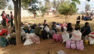 Displaced people are seen with their belongings after fighters of the Myanmar National Democratic Alliance Army (MNDAA) launched an attack on March 6 on police, military, and government sites in Laukkai, Myanmar March 8, 2017. Picture taken March 8, 2017.