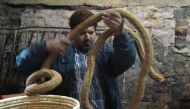 Indian street magician Ishamuddin Khan preparing to perform in New Delhi. AFP / Dominique Faget